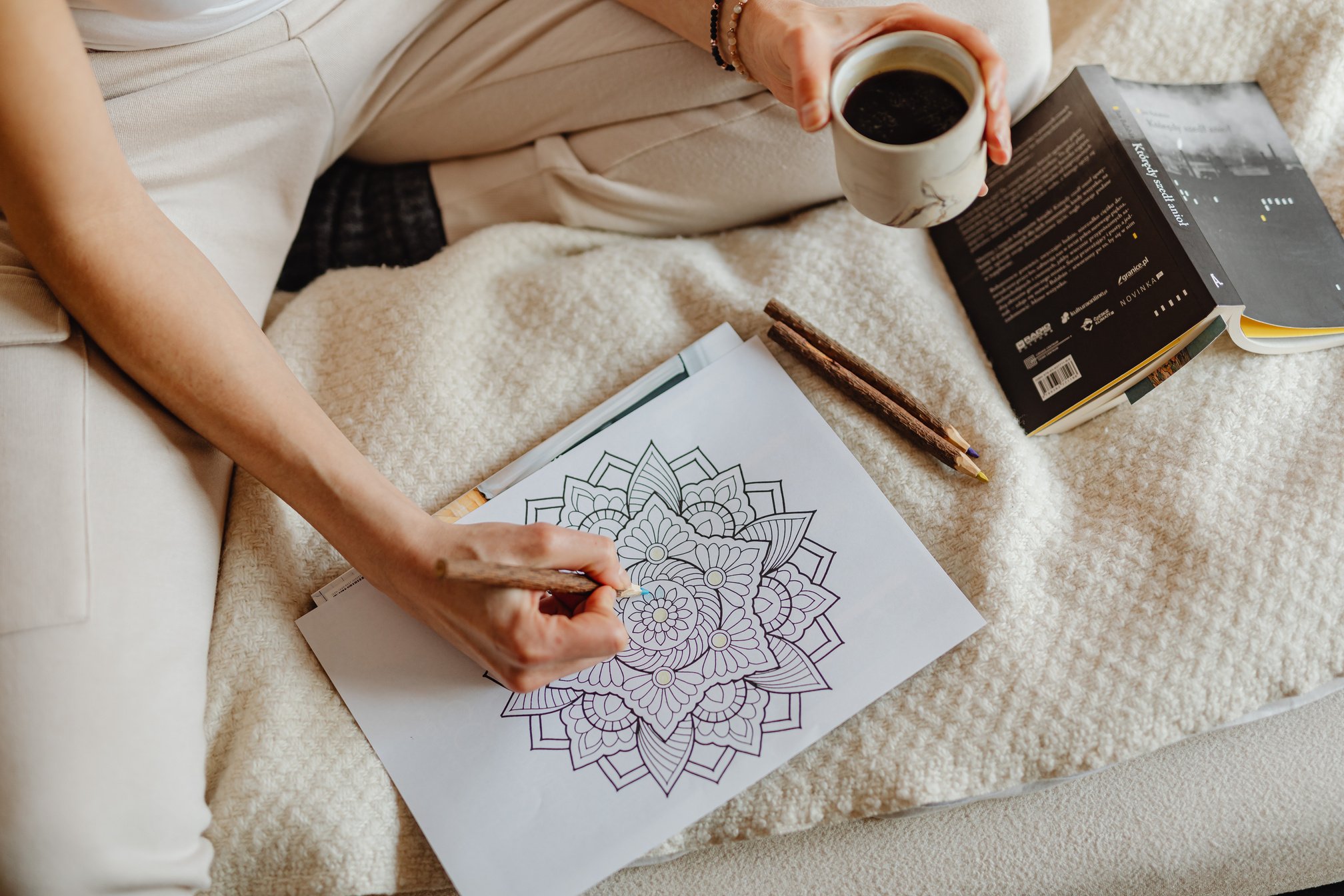 Woman Coloring A Book Page